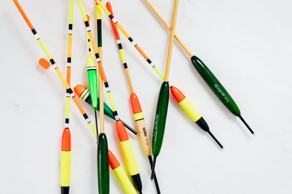 Crafting Captivating Headlines: Your awesome post title goes here Vibrant fishing bobbers arranged on a white surface, showcasing variety in color and style.